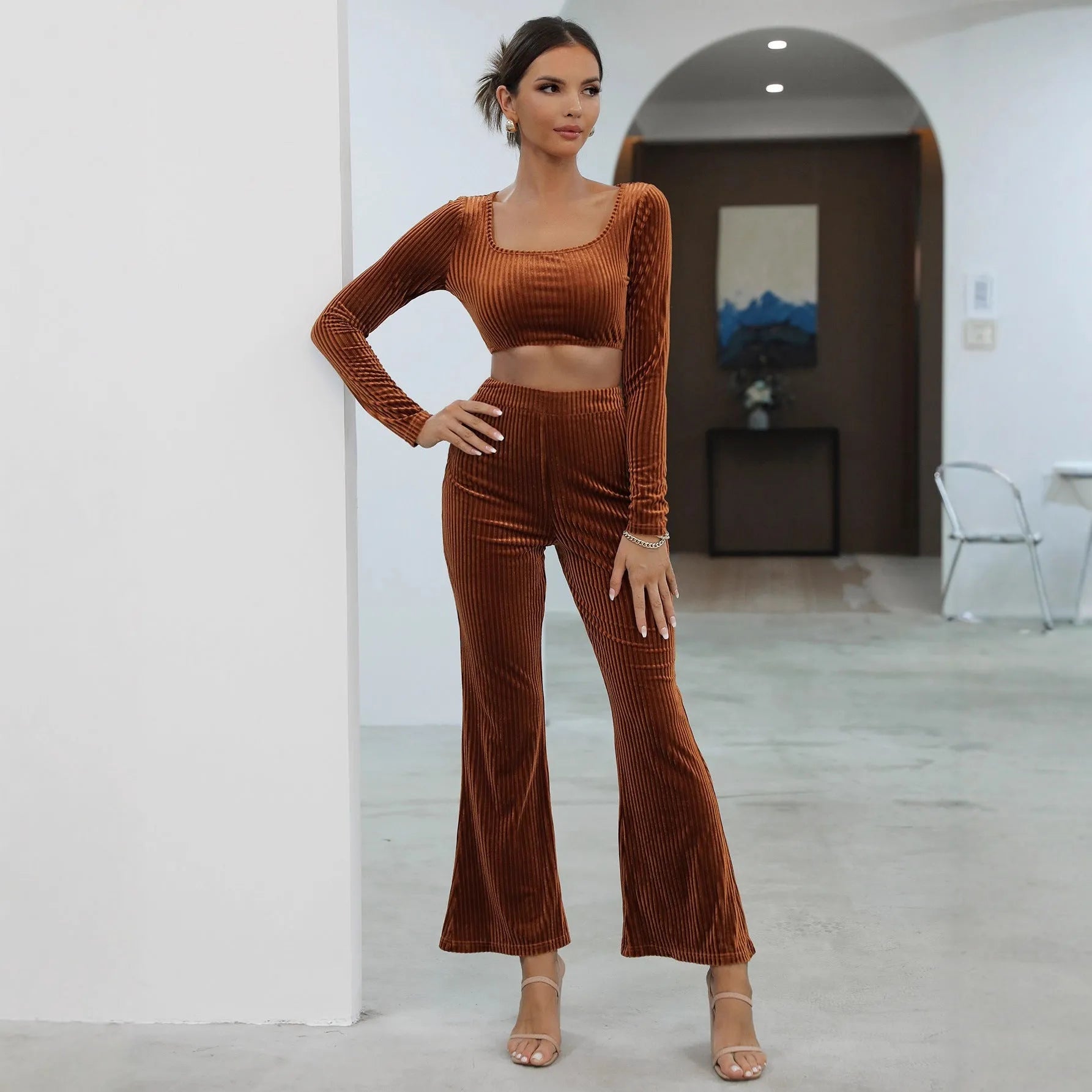 Caramel coloured long sleeve sweater set with matching trousers on hanger