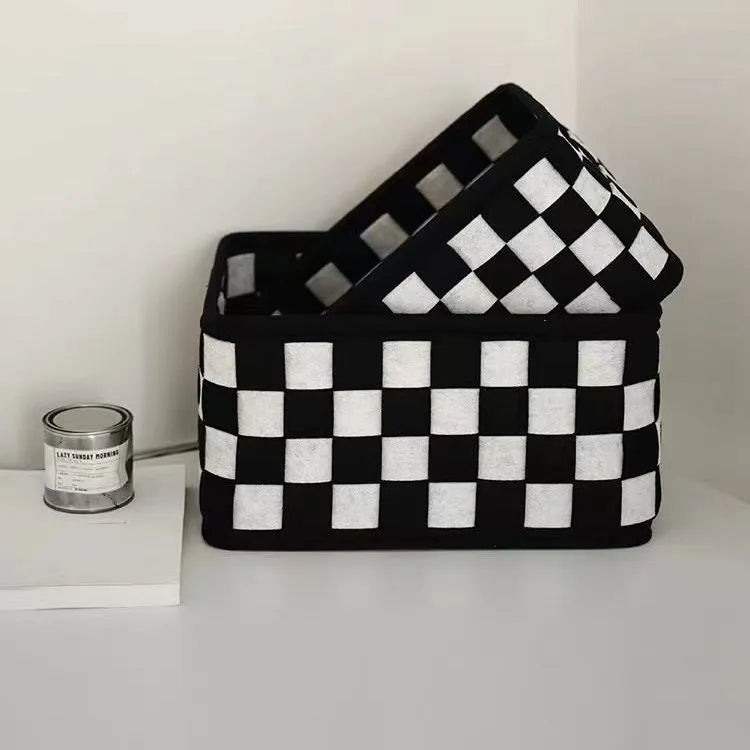 Checkerboard woven grey felt storage basket with folded sides showing its 37x29x19.5cm size.