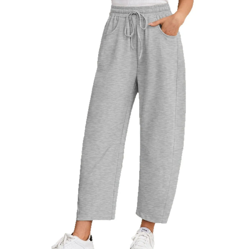 Women's loose cropped sweatpants with drawstring waist and side pockets in apricot colour