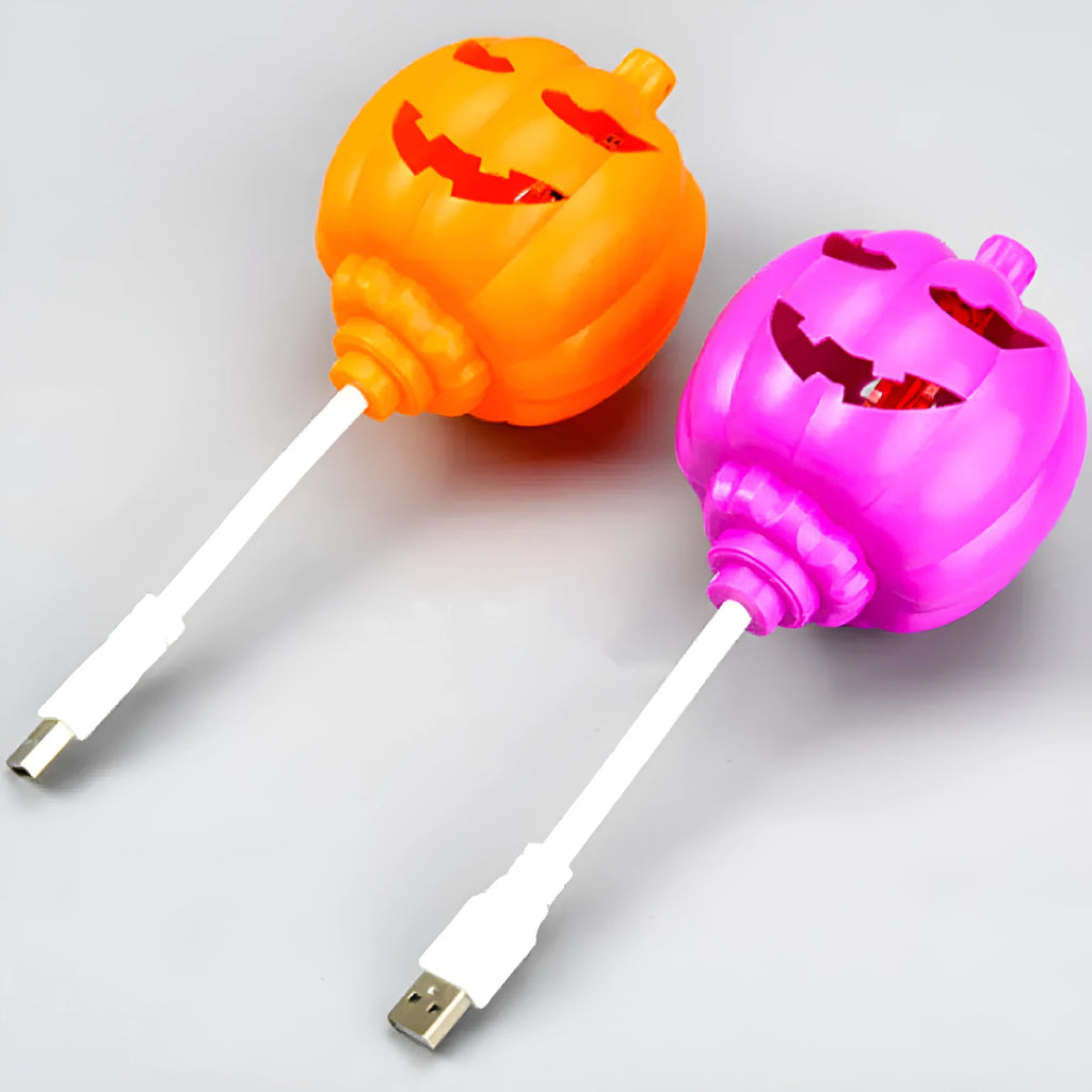 Plastic pumpkin lamp with USB port showing yellow and purple light options
