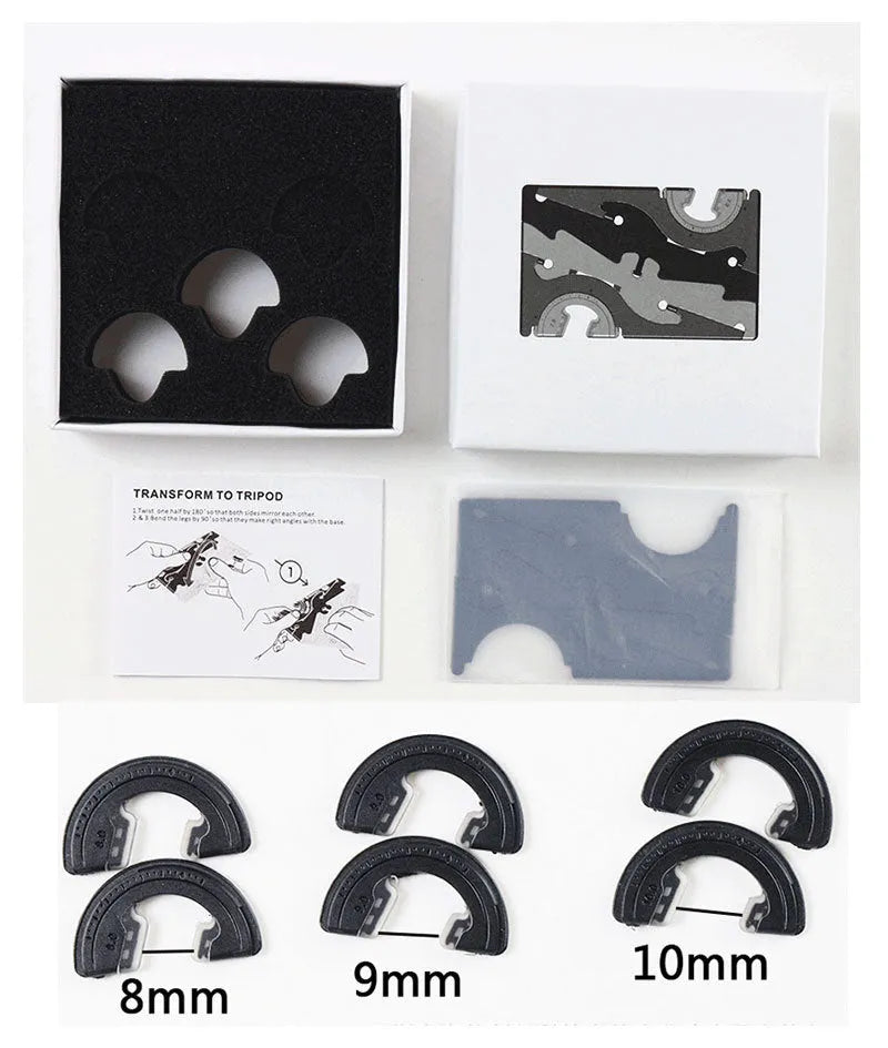 Black plastic card type mobile phone holder for desktop use on a wooden desk