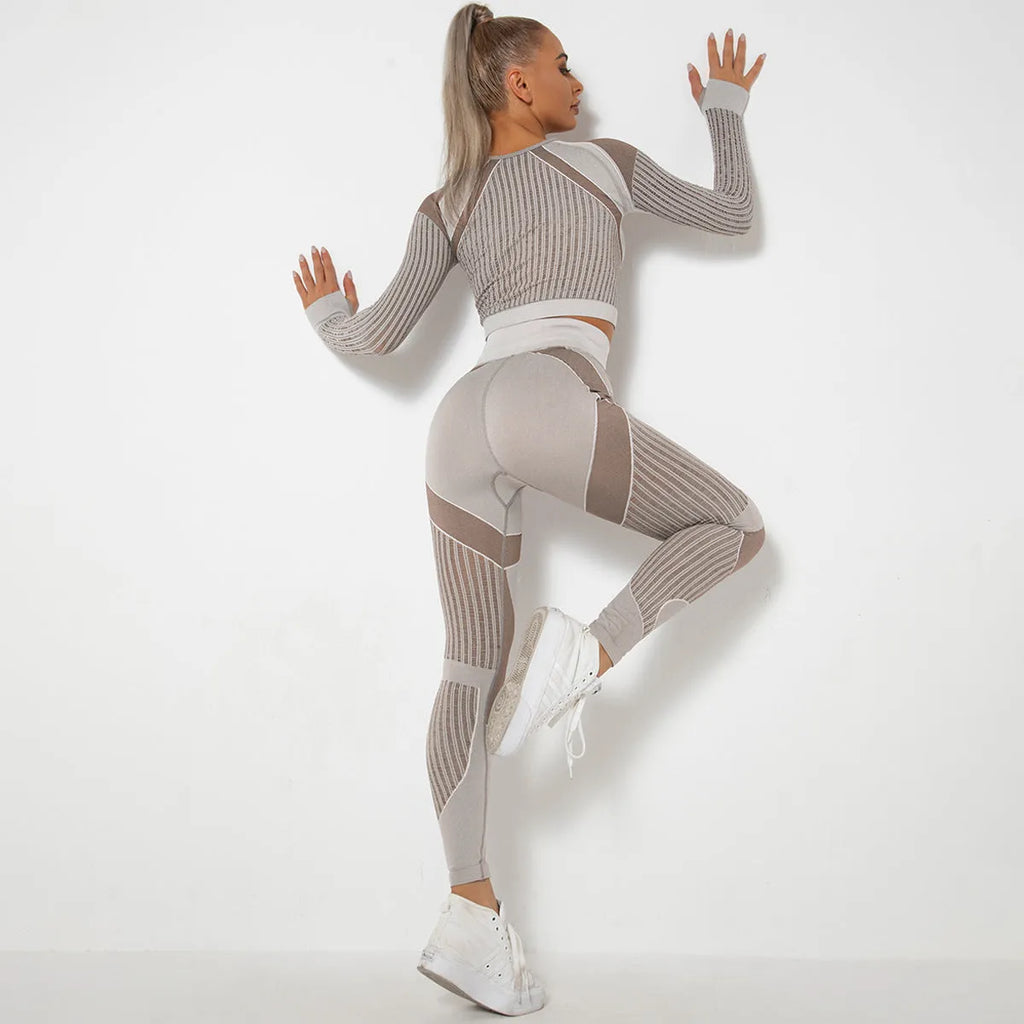 Women's long-sleeved seamless knitted yoga suit in a stripe pattern, shown in navy blue.