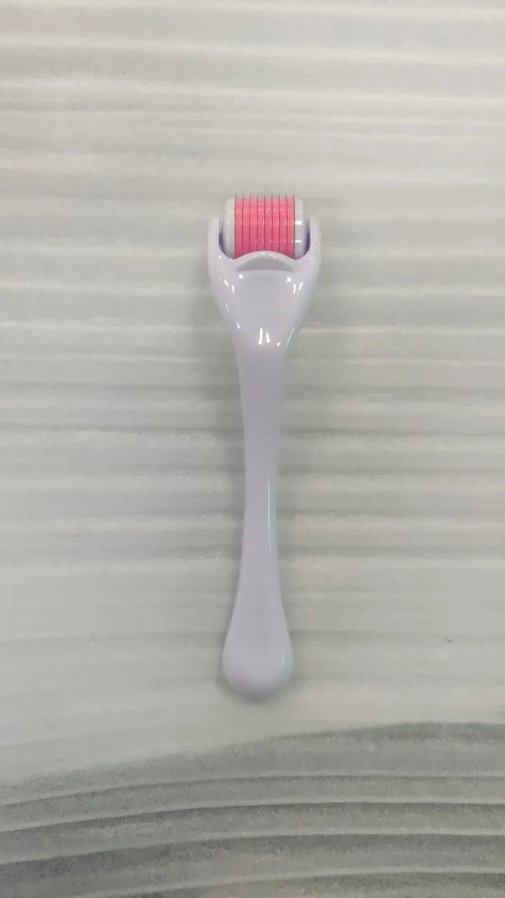 Professional 540 needle dermaroller for mechanical font with coloured handle and wheel, showing sterile stainless steel needles.