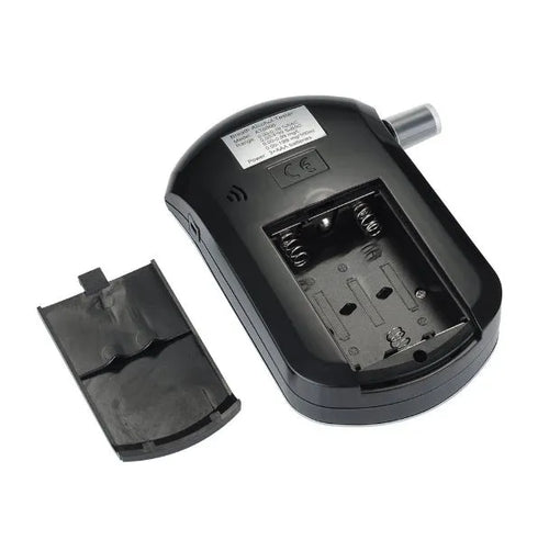 Black portable alcohol breath tester with digital display and mouthpiece attached
