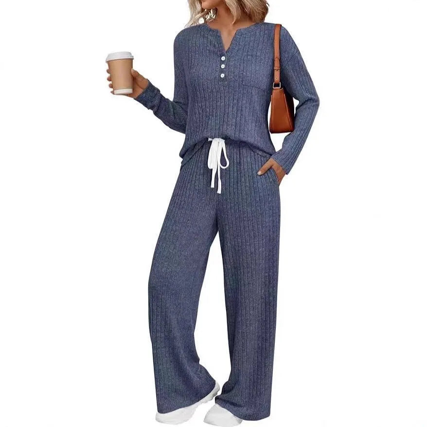 Women's striped knitted long coat with V-neck, long sleeves, lace-up detail, and side pockets.