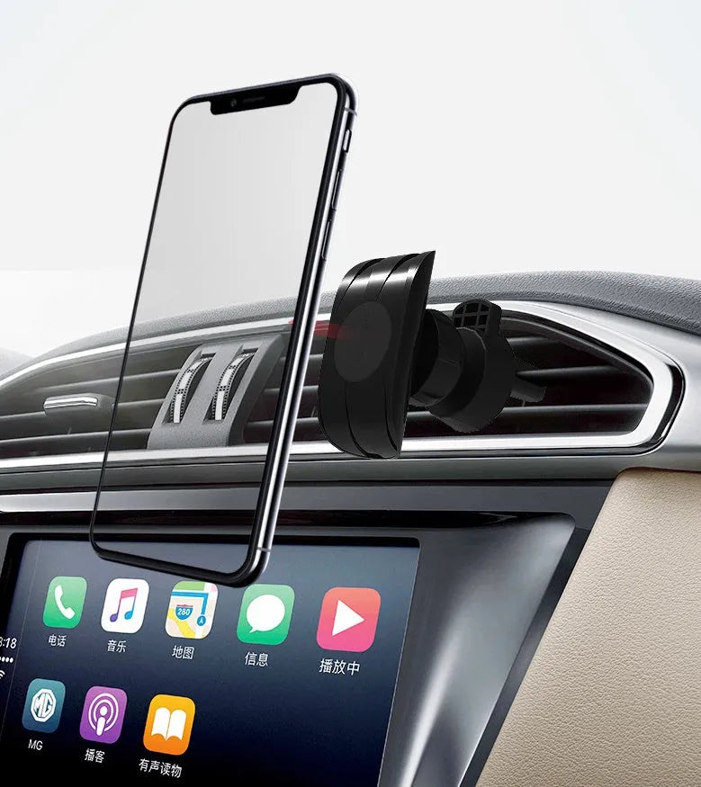 Black car phone holder attached to vehicle air vent holding smartphone