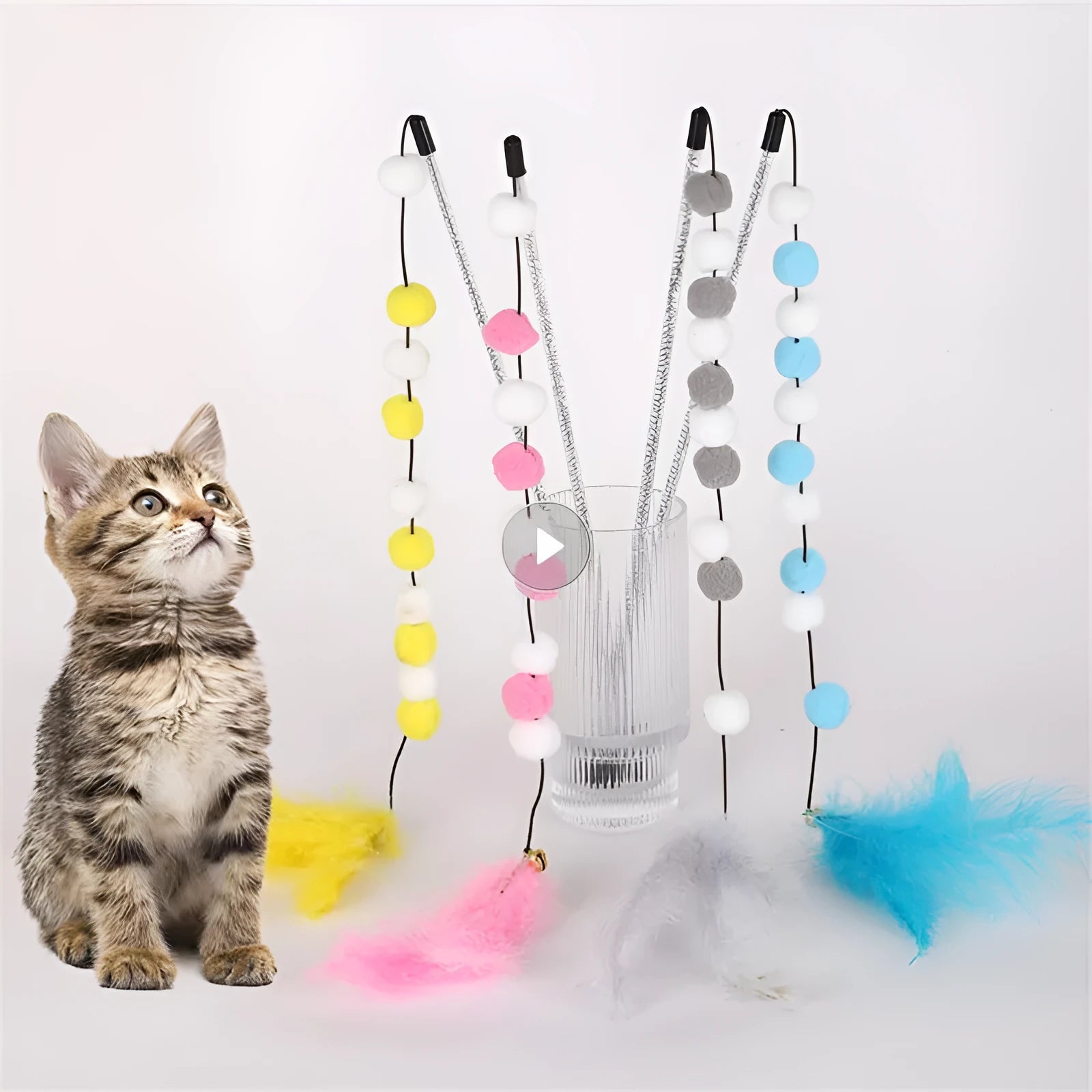 Grey, yellow, and blue cat teaser toy rod with feather, pompon, and bell measuring 31cm.