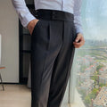 Men's straight-leg casual trousers in a solid colour on a hanger.