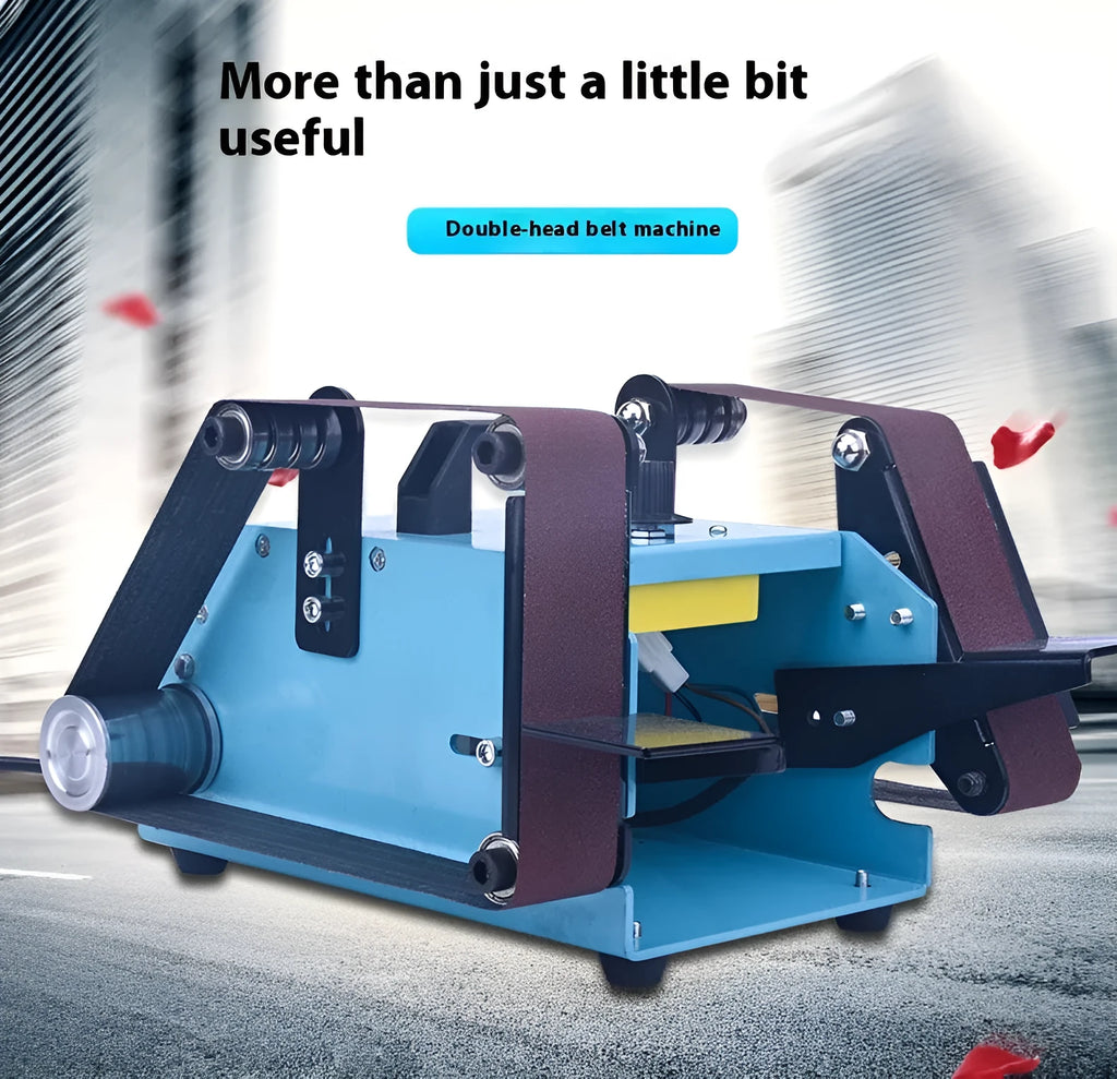 Blue desktop dual-axis belt sander with variable speed control and included knife sharpening tool on a workbench.