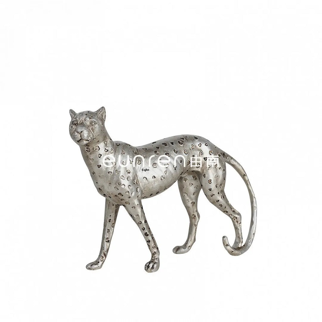 Modern resin leopard ornament in American Leopard colour on a shelf.