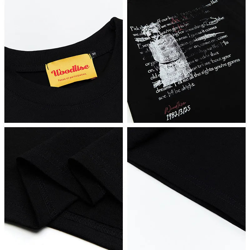 Men's black loose-fit pure cotton t-shirt with white printed letter design and raglan sleeves.