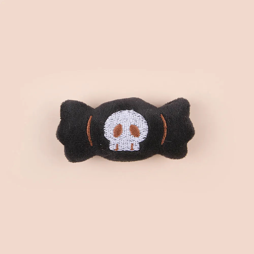 Small plush cat teaser toy with flexible handle in candy, eyes, or skull design