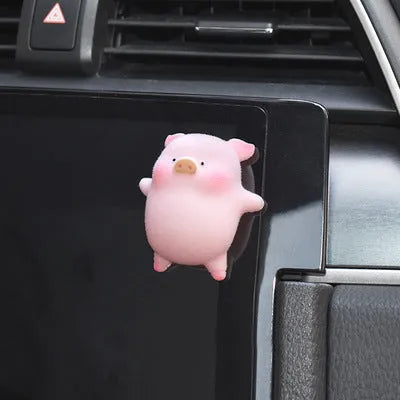 Colourful 3D resin cartoon pig figurine car decoration on a car dashboard