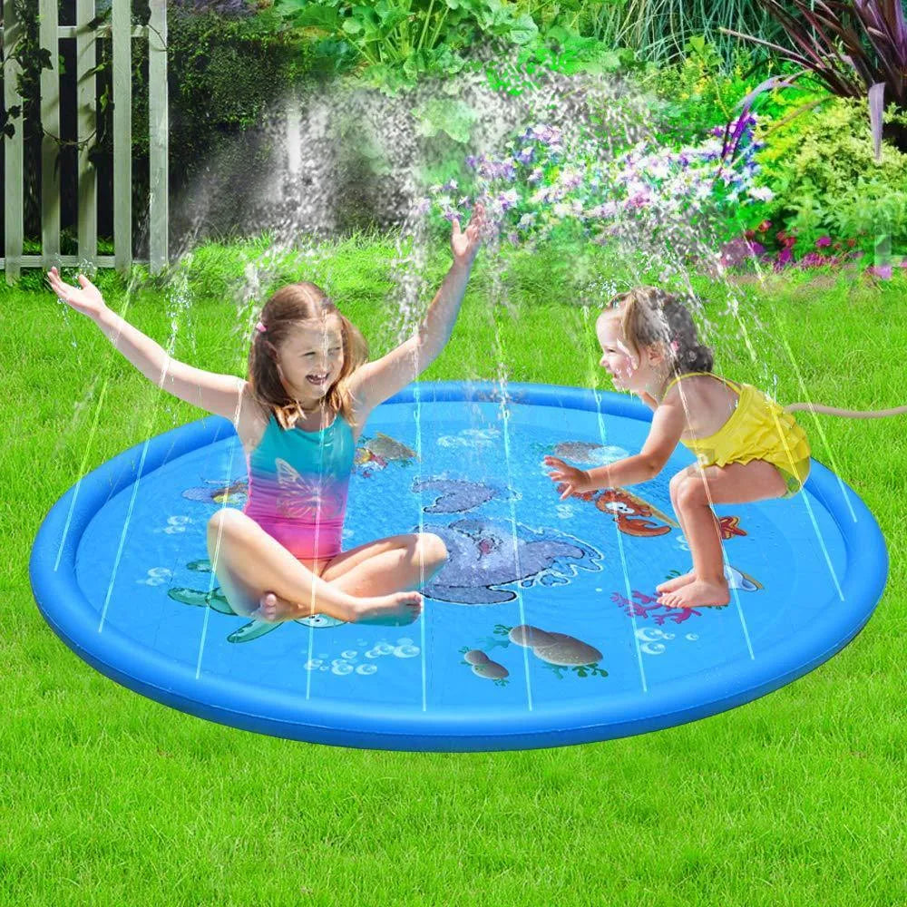 Blue PVC children's water spray play mat with marine animal designs laid out on grass.