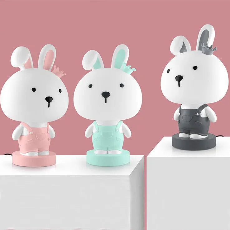 Cartoon animal table lamp in bear, cow, rabbit, or tiger design with plastic shade and LED light.