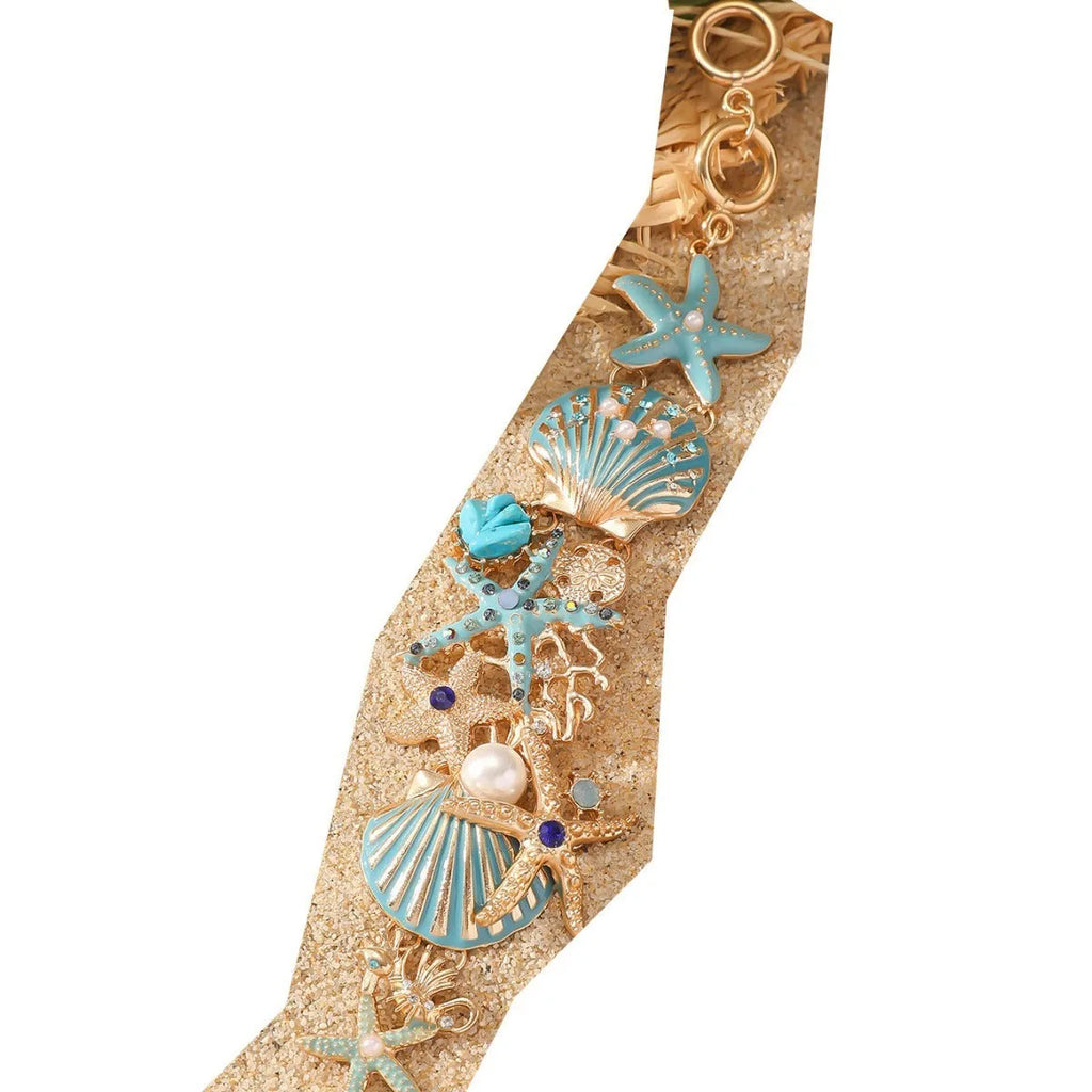 Women's alloy bracelet with boat anchor and rhinestone starfish design in turquoise, red, or blue.
