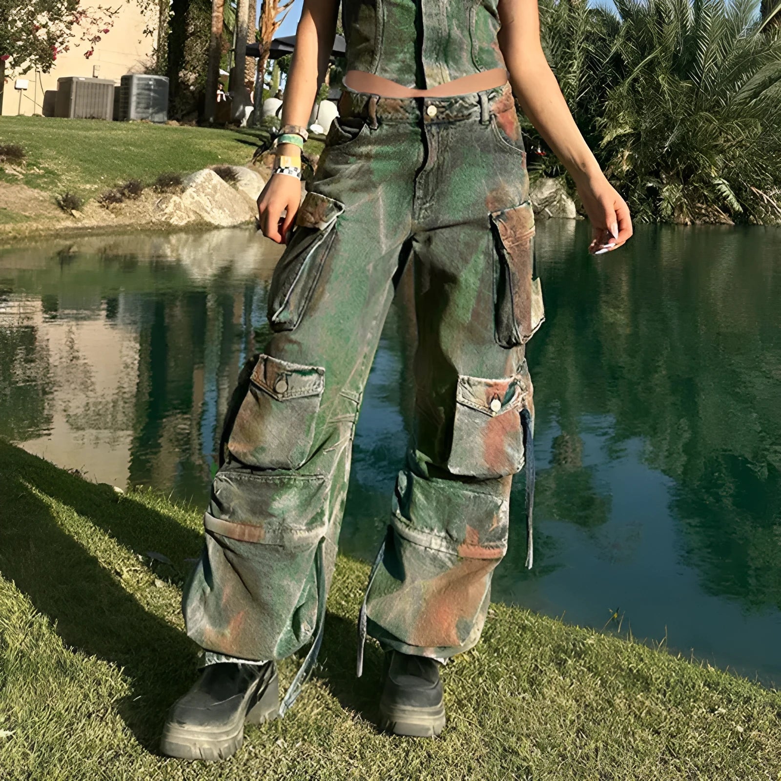 Loose-fit blue denim cargo trousers with multiple front pockets showing gradient colour details