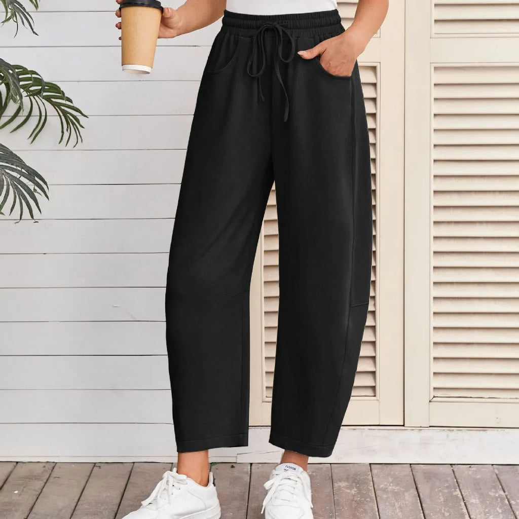 Women's loose cropped sweatpants with drawstring waist and side pockets in apricot colour