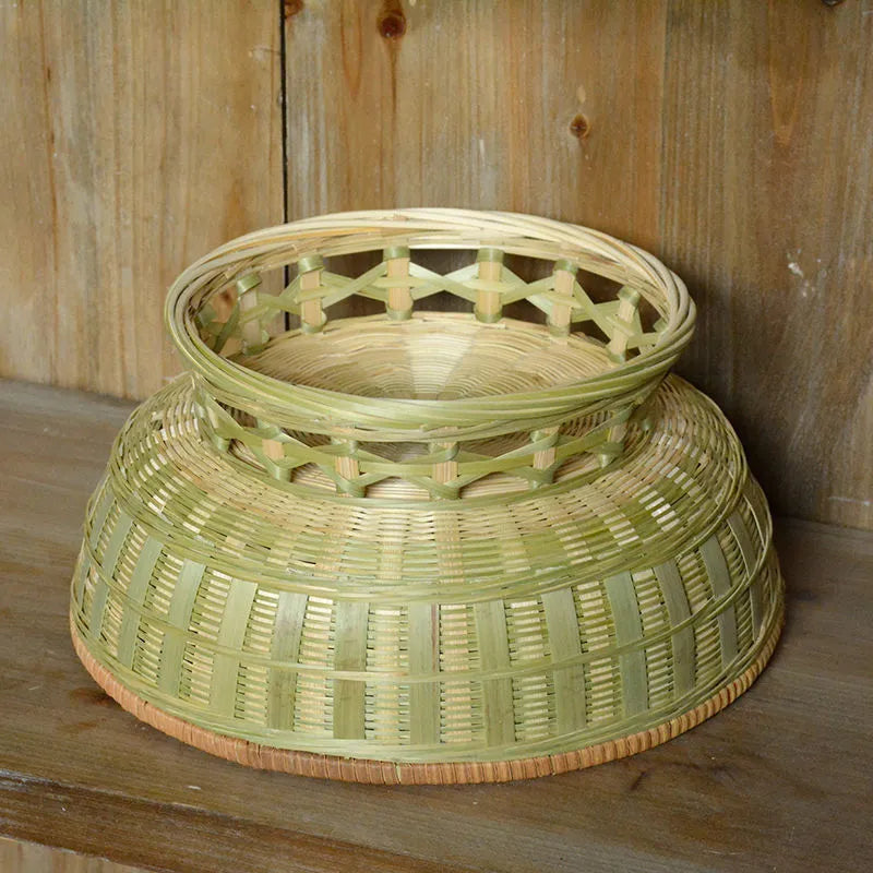 Handmade natural bamboo storage basket shown in a household setting.