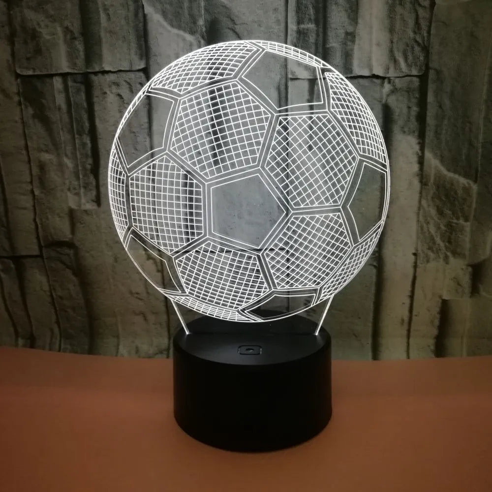 3D football shaped night light with colourful LED illumination on a black ABS base.