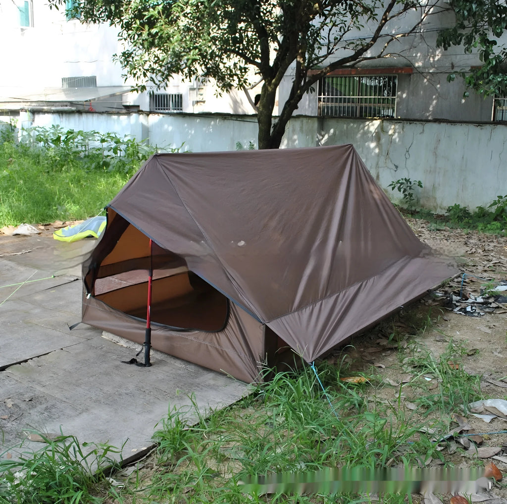 Brown A-line cabin tent setup with hiking pole supports showing spacious interior and waterproof fabric construction
