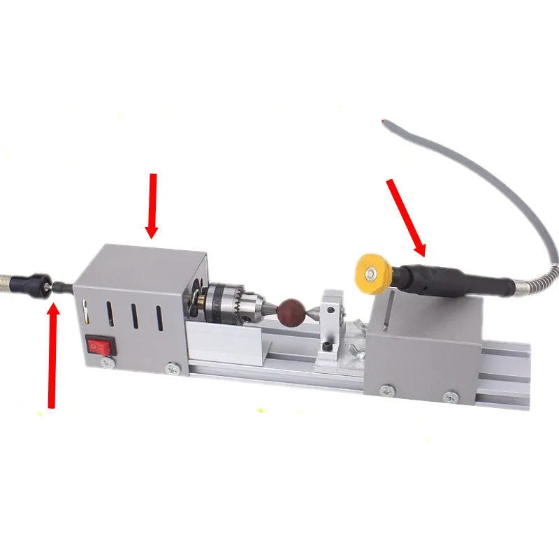 Compact metal manual woodworking lathe on workbench with carving knives