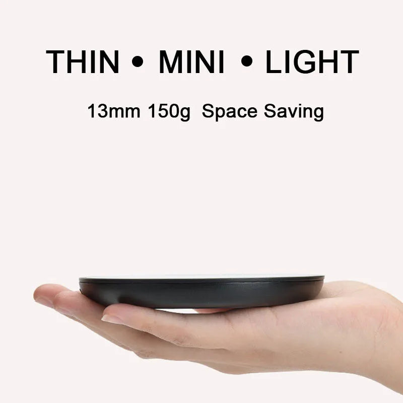 Black circular mug warmer with tempered glass surface and temperature switch