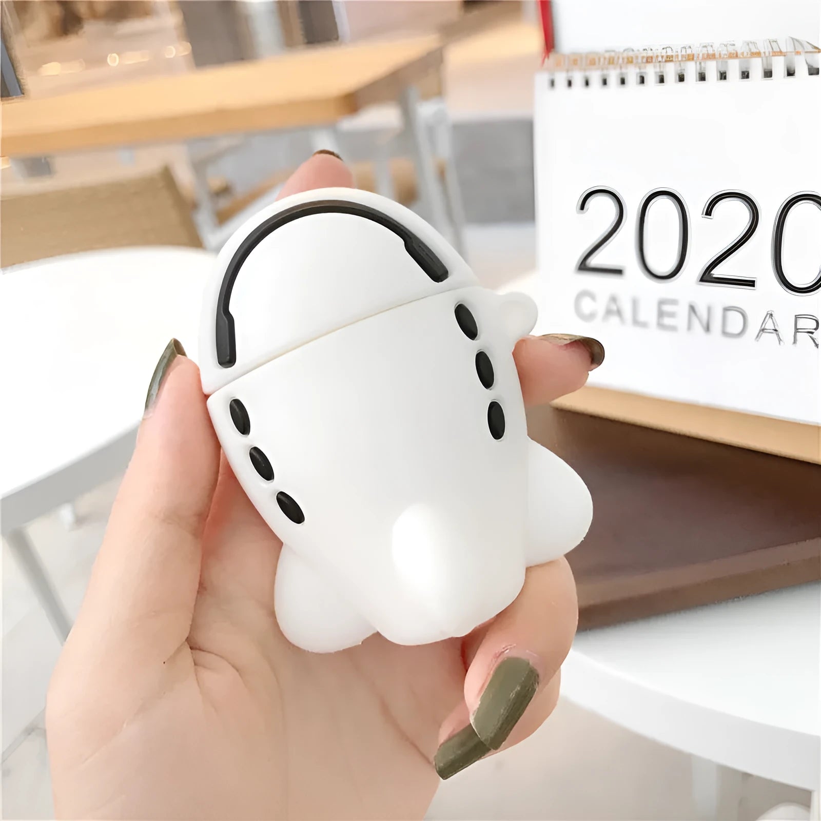 Cartoon aircraft headset design silicone flip case for Apple AirPods with carrying hook.