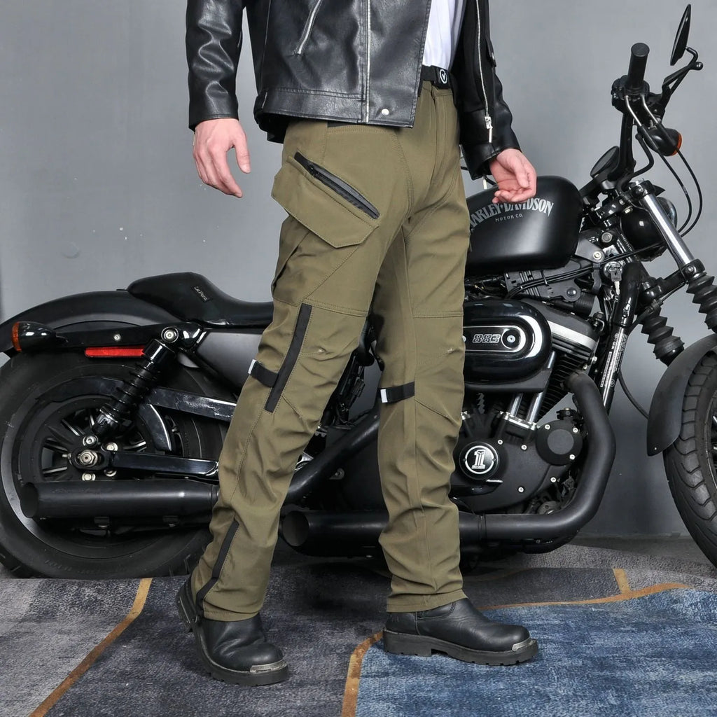 Men's black waterproof motorcycle pants with belt and protective gear set on a neutral background.