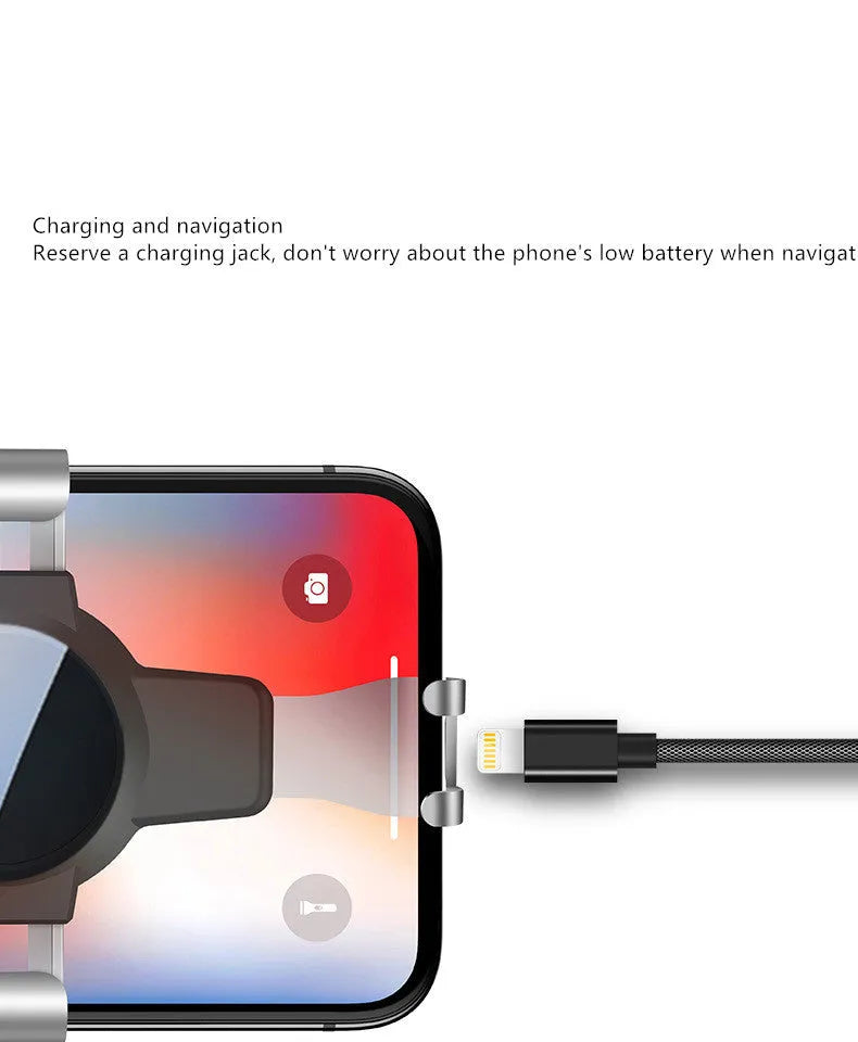 Black S4 ABS gravity mirror mobile phone bracket mounted on a car air conditioning vent.