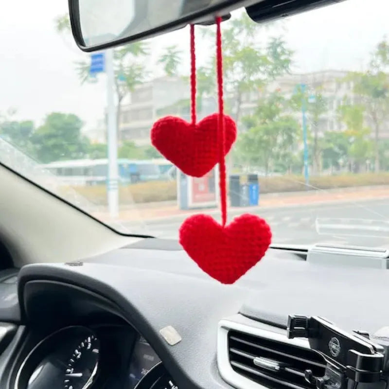Knitted green and white car plant decoration with hanging rope