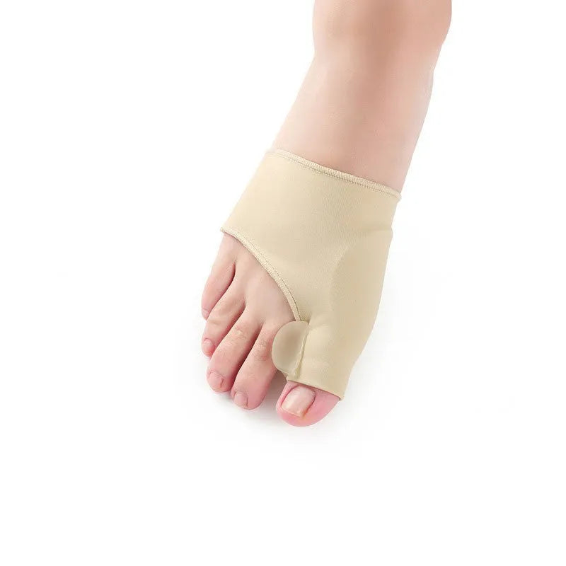 Pair of beige corrective toe socks with a clear silicone gel bunion pad and toe separator.