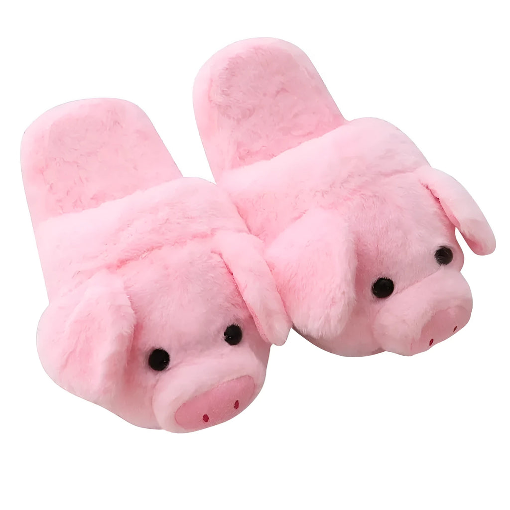 Pink pig-shaped floor slippers with a soft plush fabric exterior.