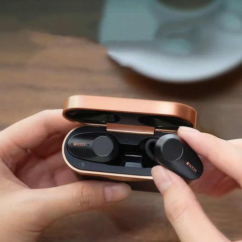 Black wireless Bluetooth stereo headset with charging stand featuring ANC noise cancellation and wireless charging