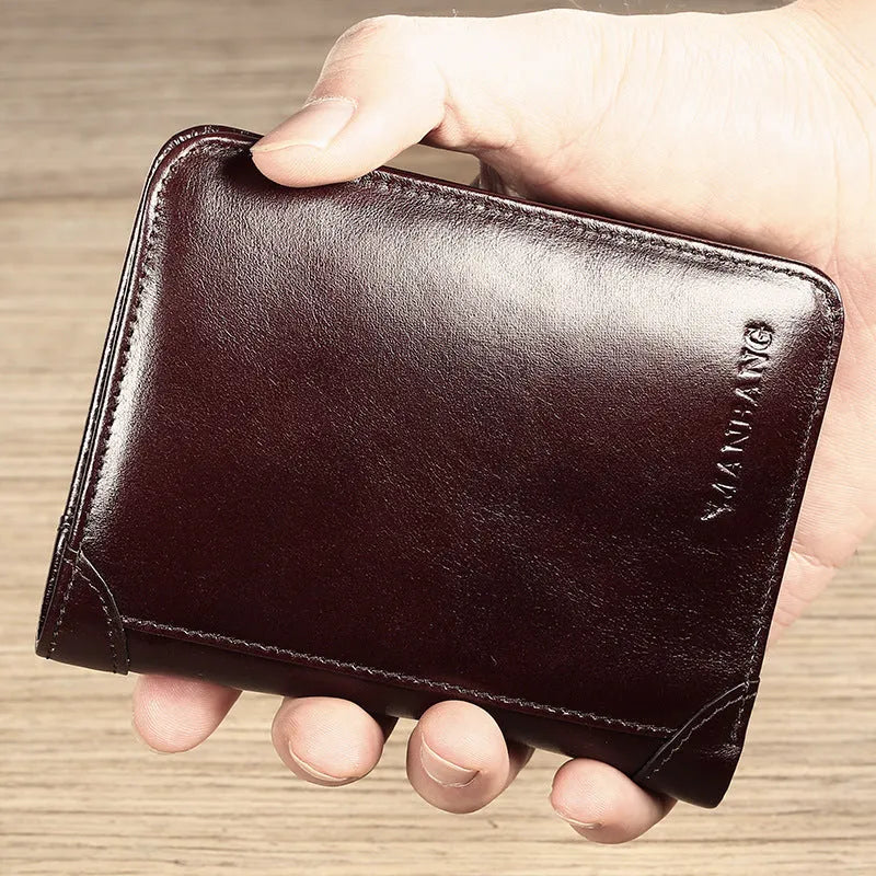 Men's brown leather bifold wallet open to show internal card slots, coin pocket, and photo holder.