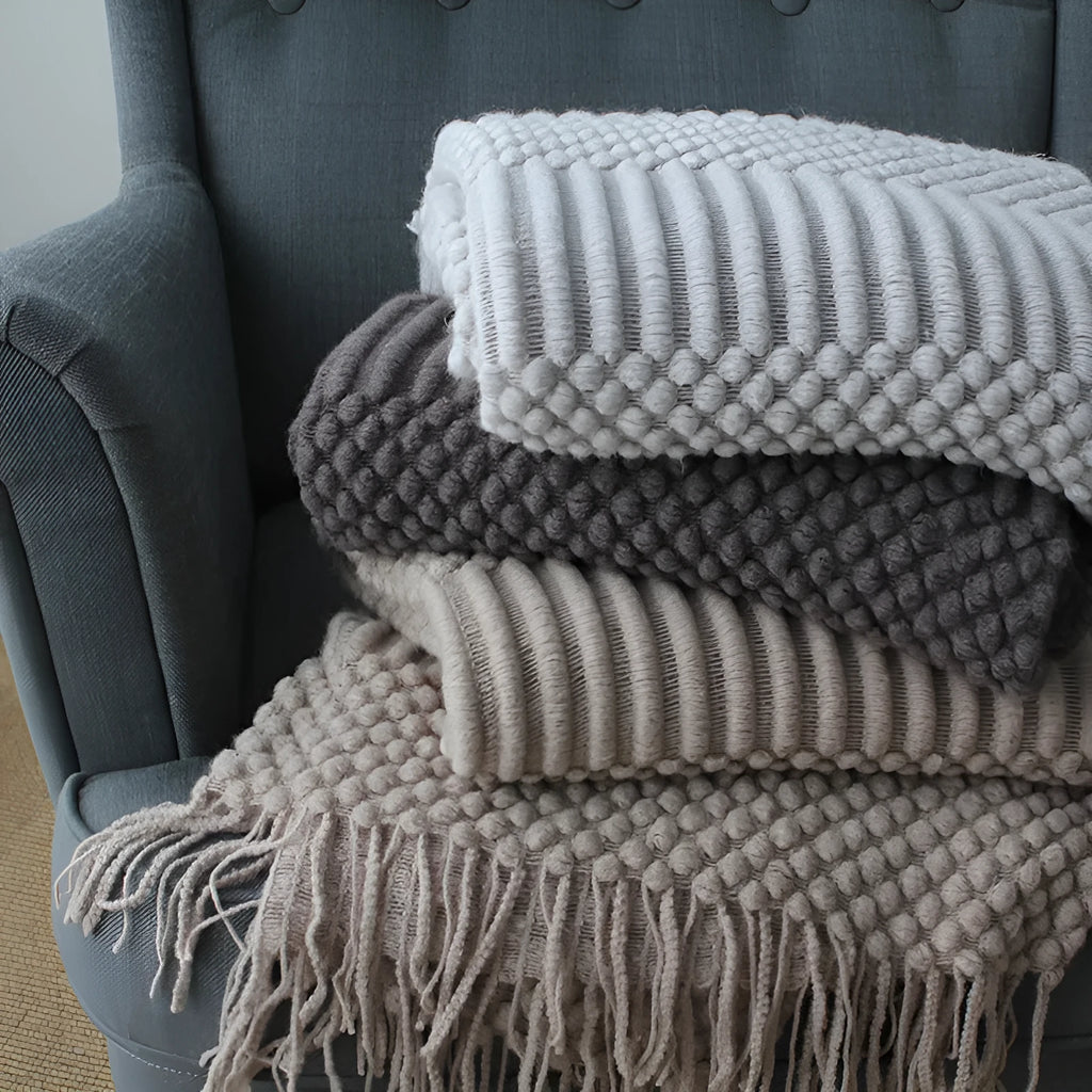 Light grey polyester nap blanket measuring 127cm by 170cm laid flat.