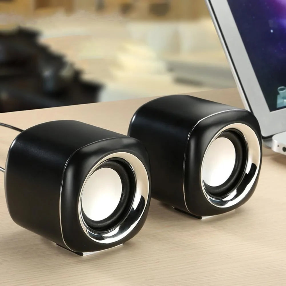 Black or white ABS mini computer speakers measuring 7.2cm with scroll wheel volume control