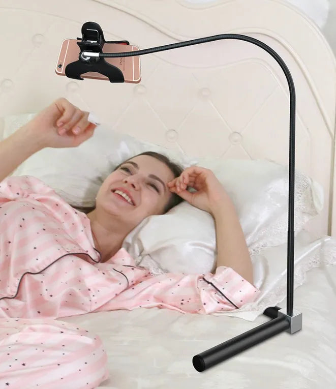 Black mobile phone bed bracket mounted bedside with phone in adjustable overhead viewing position