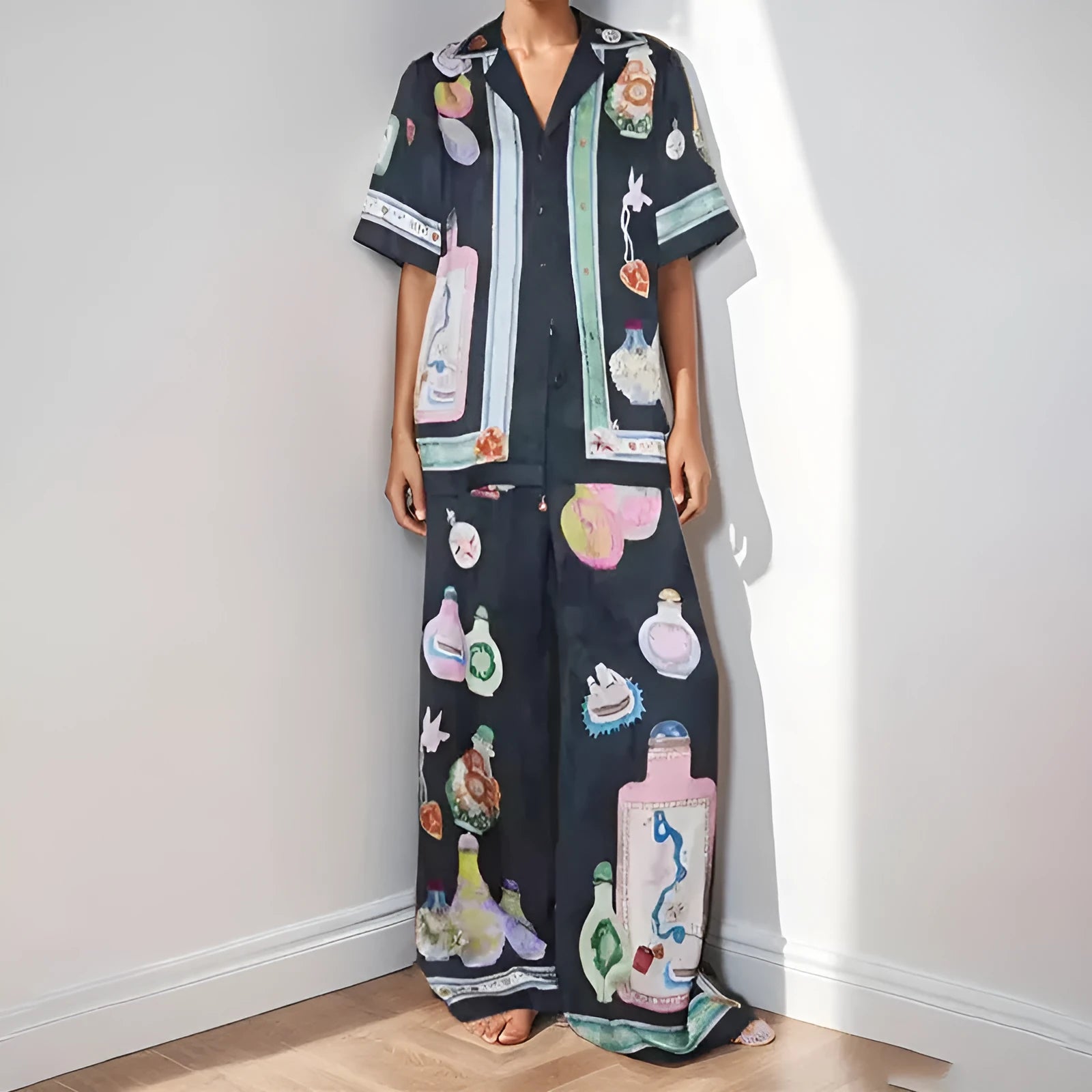Women's black cartoon pattern holiday fashion set with trousers and cardigan-style top