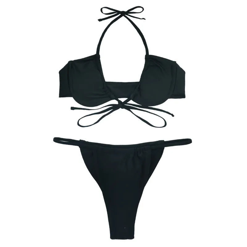 Women's two-piece black and mint green bikini swimsuit with split design