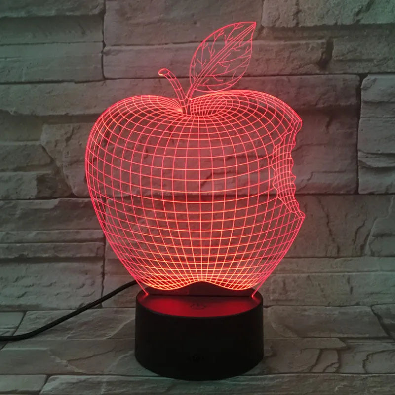 Colourful 3D fruit-shaped LED night light with touch control on a surface.