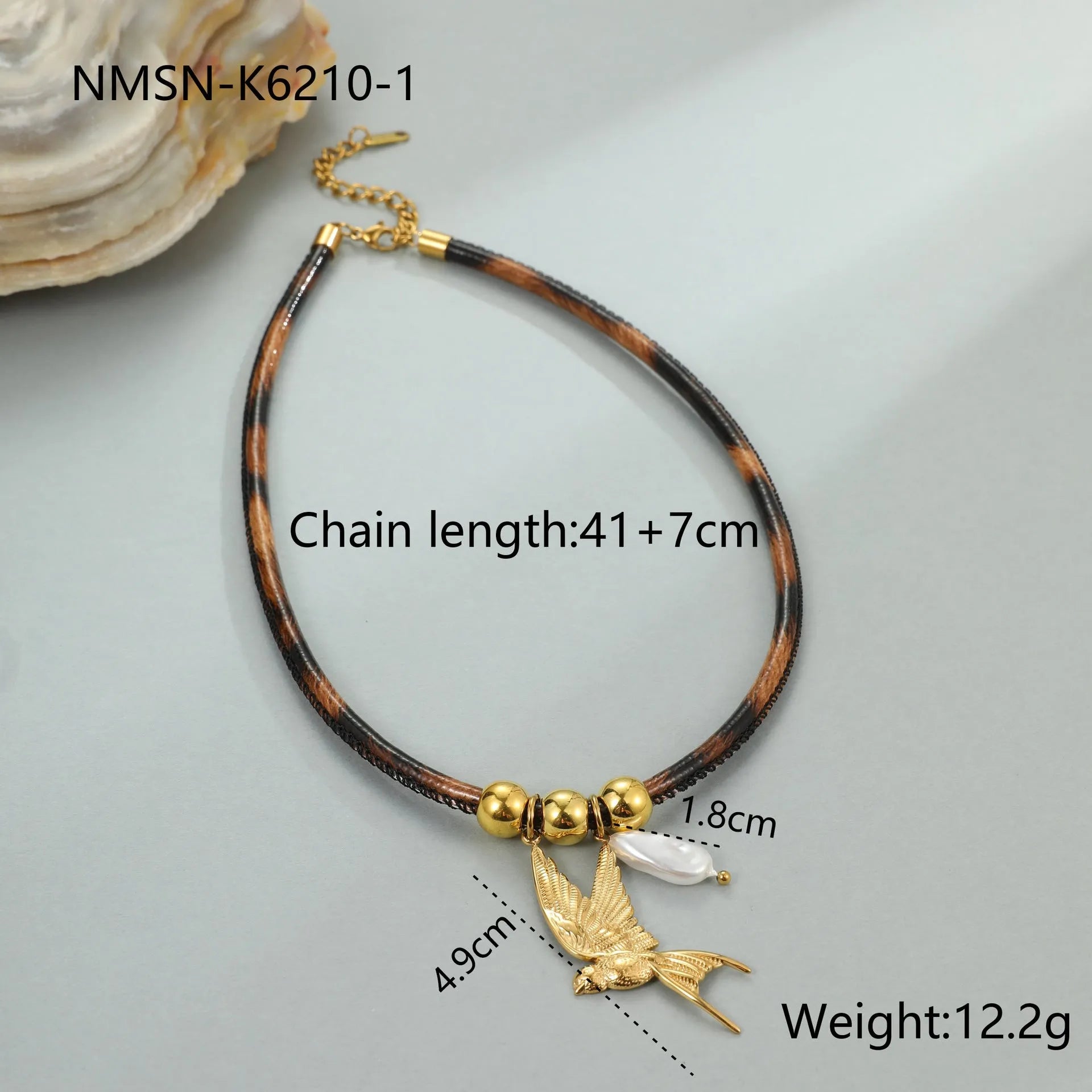 Gold plated stainless steel necklace with geometric leopard pendant and adjustable chain on white background