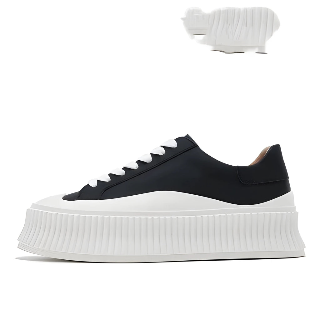 Women's black suede thick sole trainer shoe with back lacing and chunky heel.