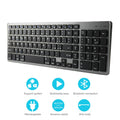 Ultra-thin white Bluetooth keyboard next to a tablet, showing its slim 13mm profile and 104-key layout.