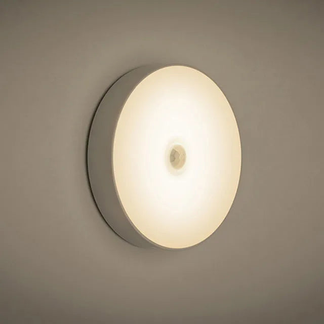 White USB rechargeable motion sensor night light with 86mm diameter showing LED light beads