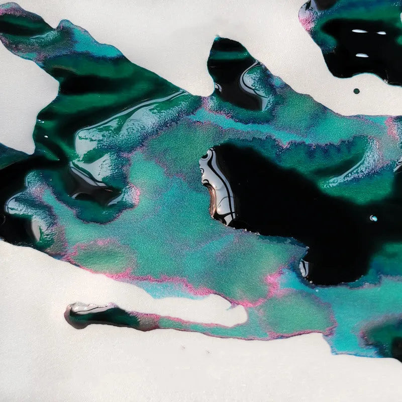 Bottle of gradient color fountain pen ink with gold powder in Red Tide or Truffle shade
