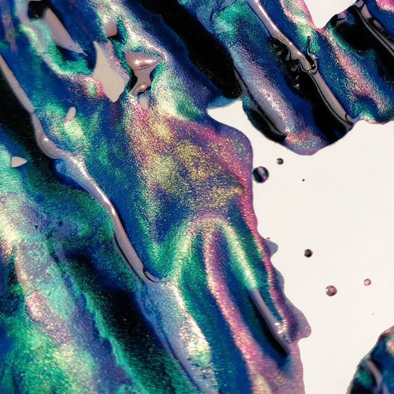 Bottle of gradient color fountain pen ink with gold powder in Red Tide or Truffle shade