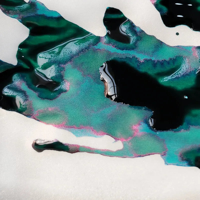 Bottle of gradient color fountain pen ink with gold powder in Red Tide or Truffle shade