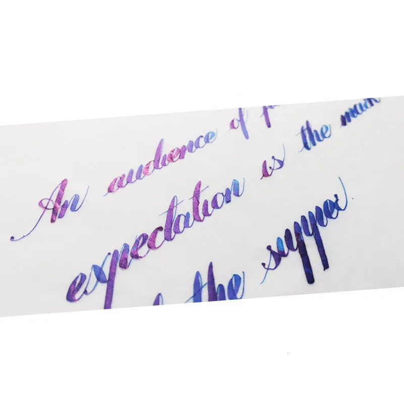 Bottle of gradient color fountain pen ink with gold powder in Red Tide or Truffle shade