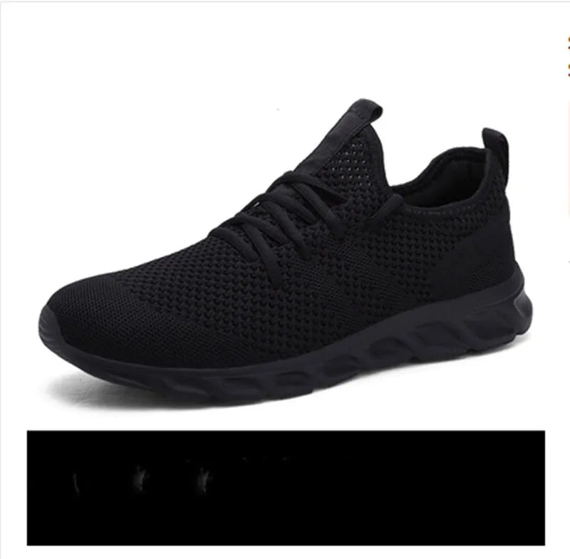 Men's black and white breathable mesh sneakers with lace-up closure and round toe design